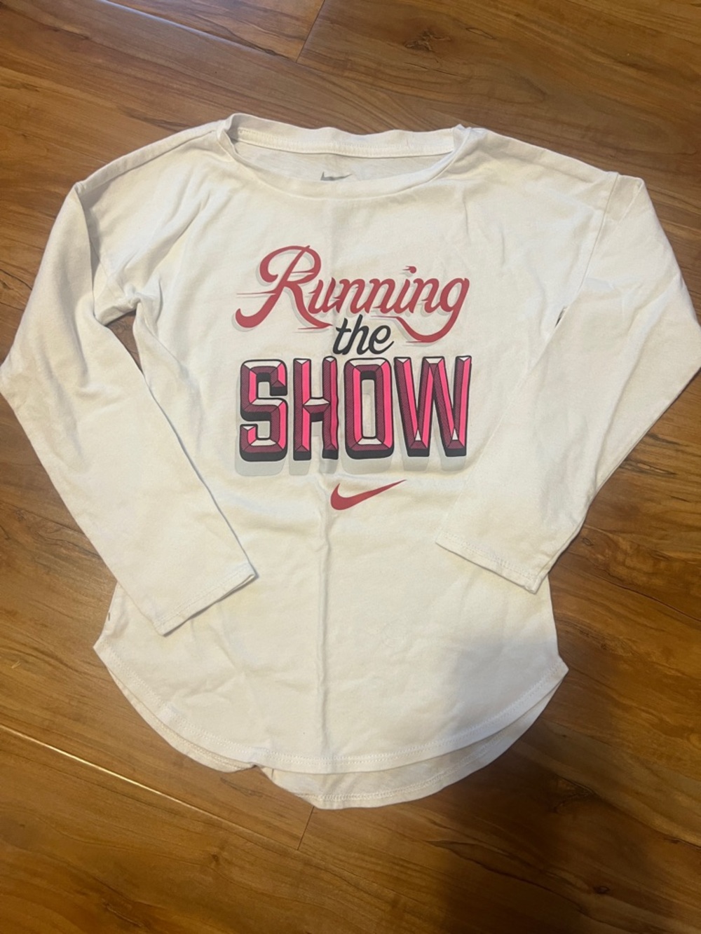 Nike White Long-Sleeve Tee with Pink "Running the Show" Graphic